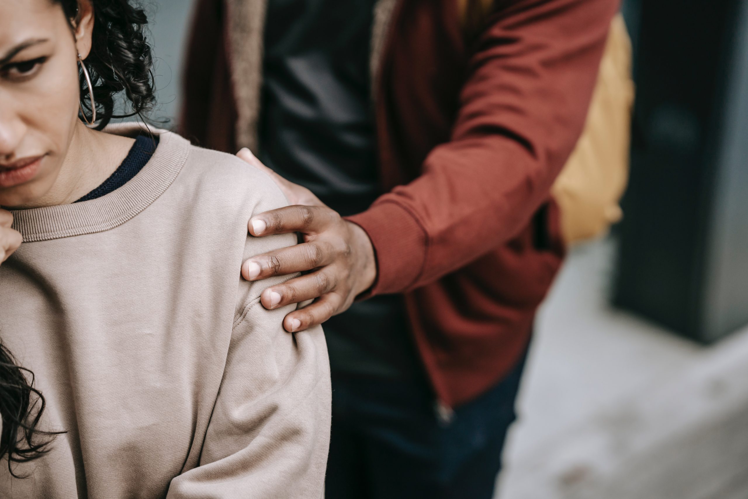 Man consoling a girl who experienced bullying