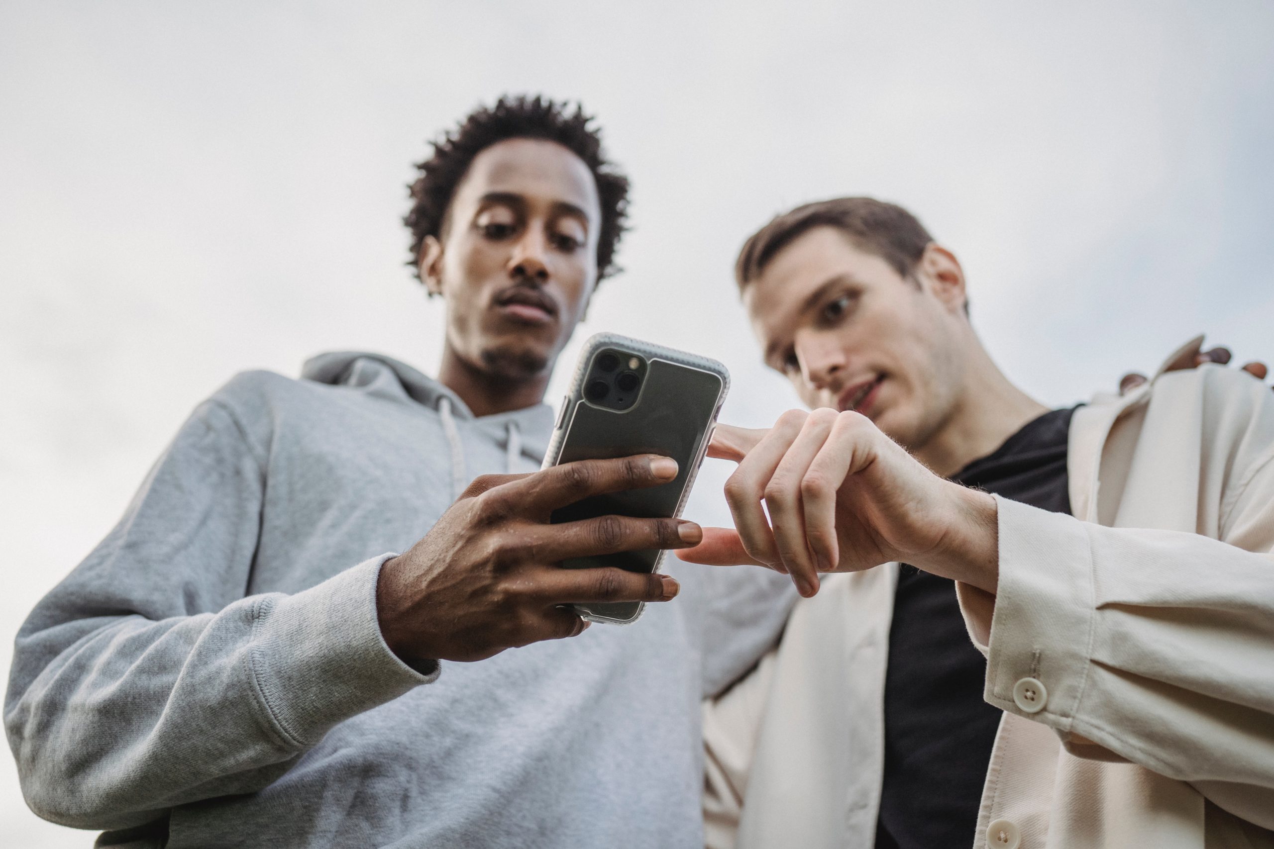 Student showing his friend his phone after being cyberbullied