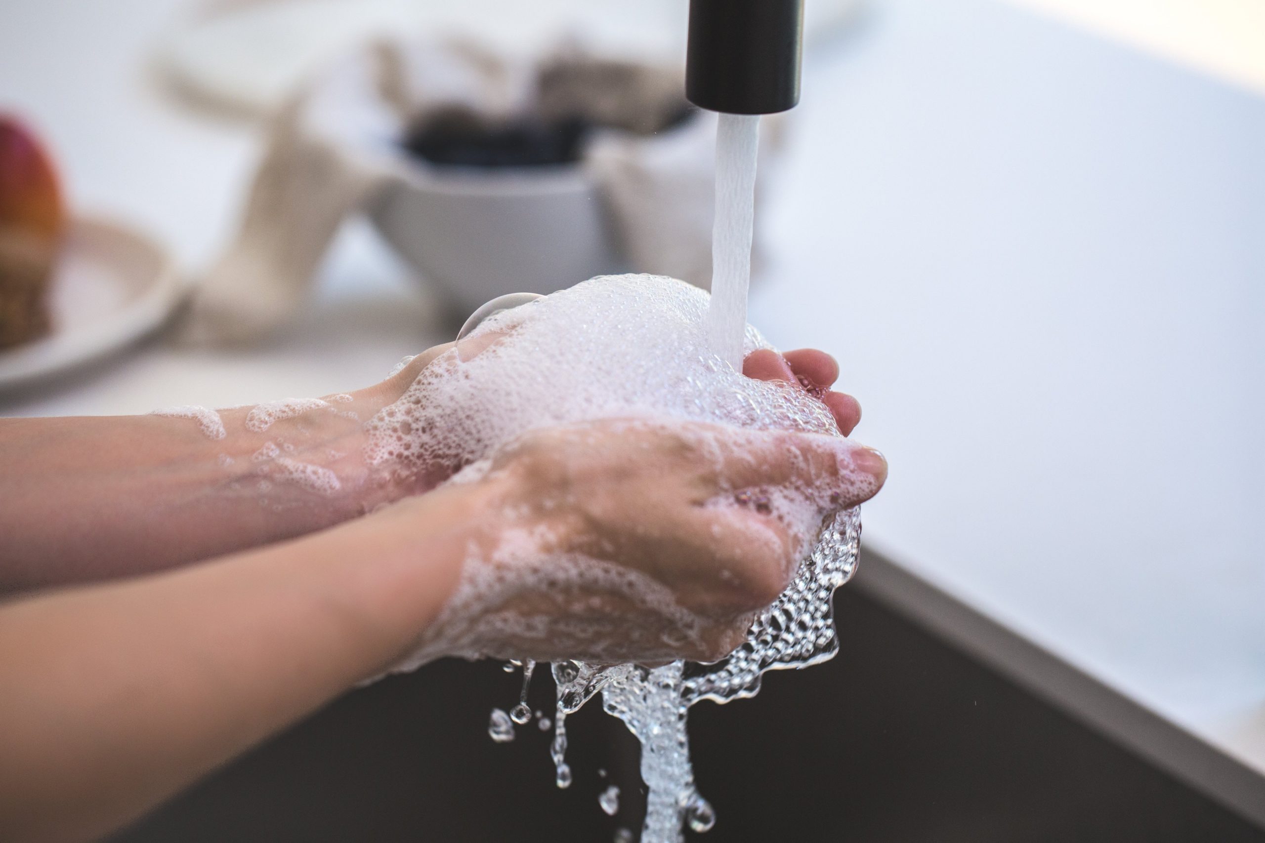 Person watching their hands with a lot of soap