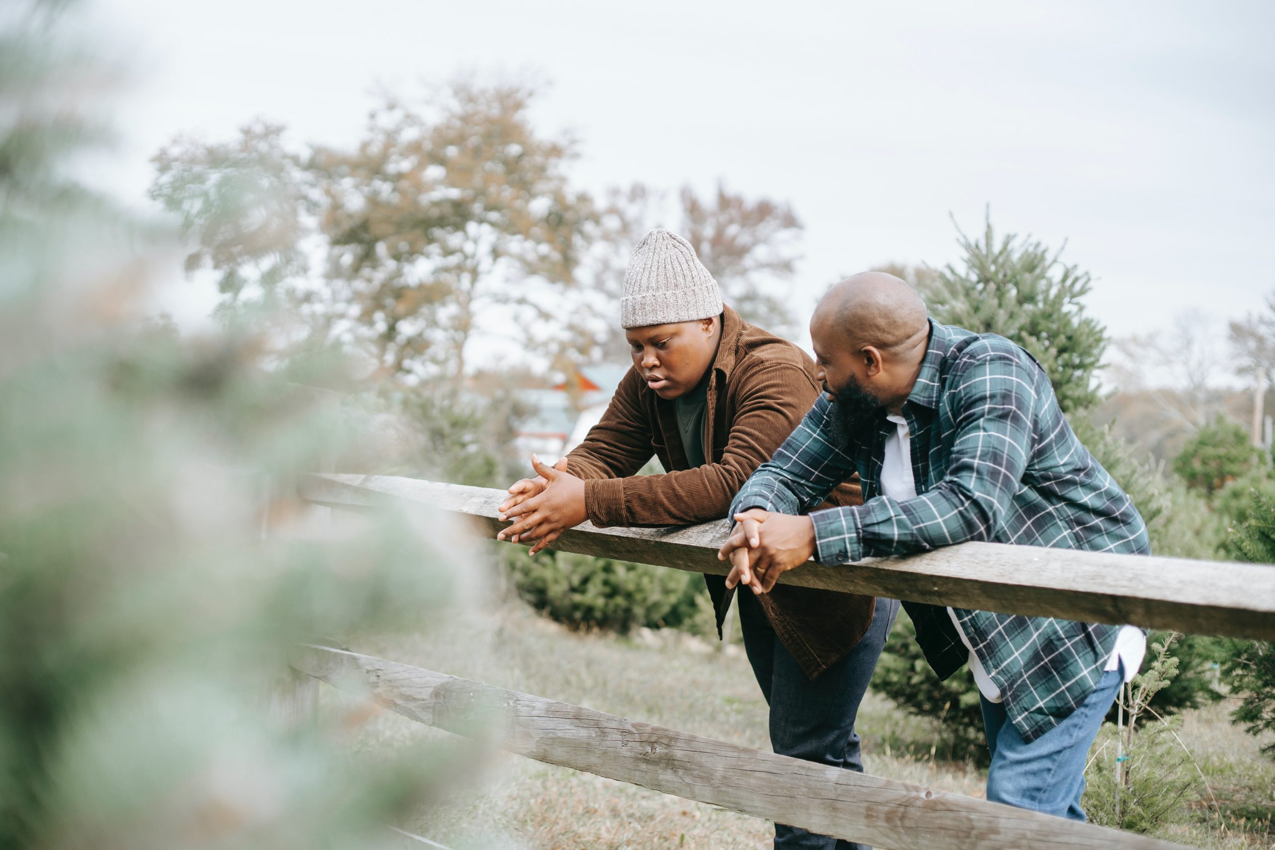 Child and his father talking outside in nature