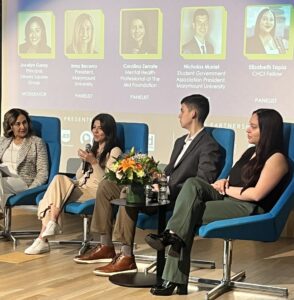 Seize The Awkward Latine Event with panelists sitting on the stage speaking to one another