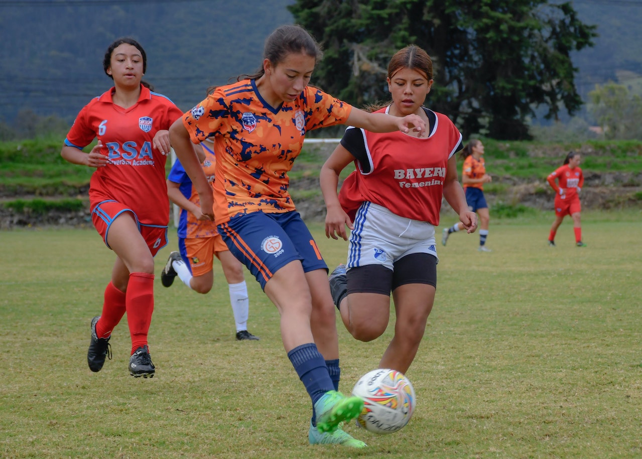 latine youth playing a soccer game