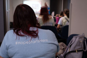 An attendee at Chandler Unified School District's Student Health Summit wears a shirt that says "#HopeStartsHere."