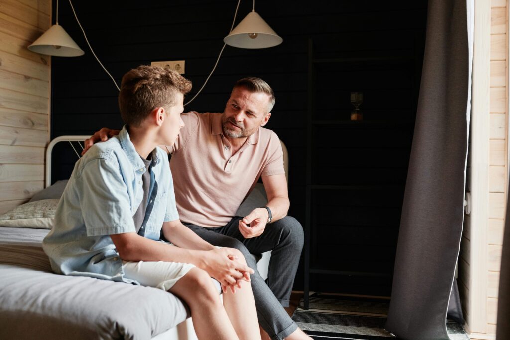 Dad talking to teen son